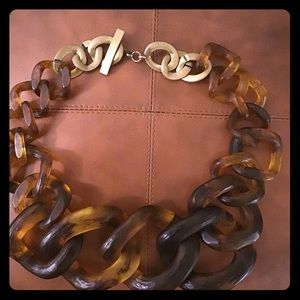 Faux horn necklace with brass clasp.